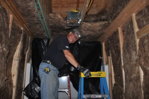 Gary installing insulation.   