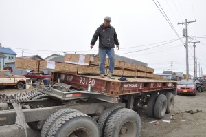 Martin oversees the unloading.   
