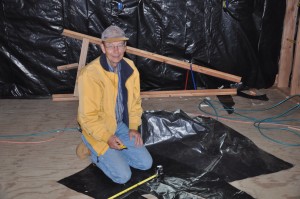 Mr. Fuscher cutting vapor barrier. 