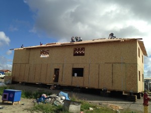 Roof decking going in place.    