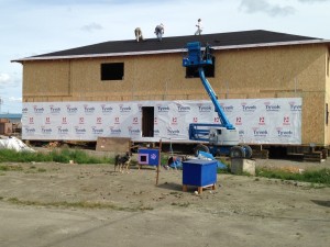 The roof felt goes on.   